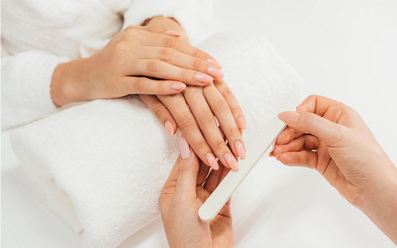 Hands of a woman with manicure on nails