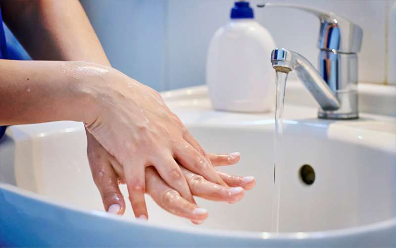 A Woman Doing The Dishes