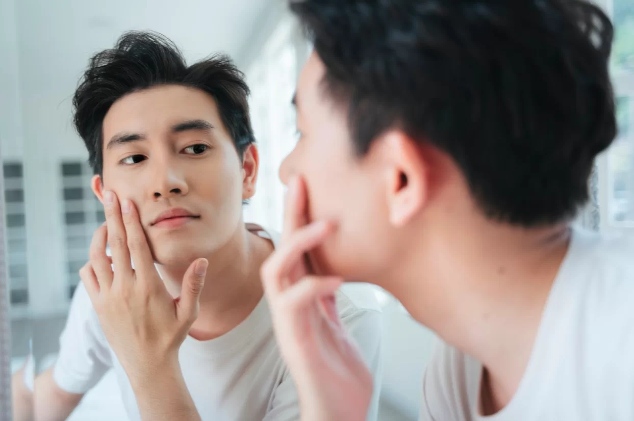 Asian Man Looking in the Mirror